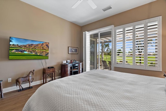 bedroom with ceiling fan, access to exterior, and wood-type flooring