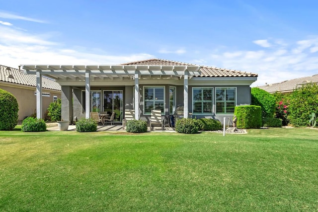 rear view of house with a patio area, a pergola, and a yard