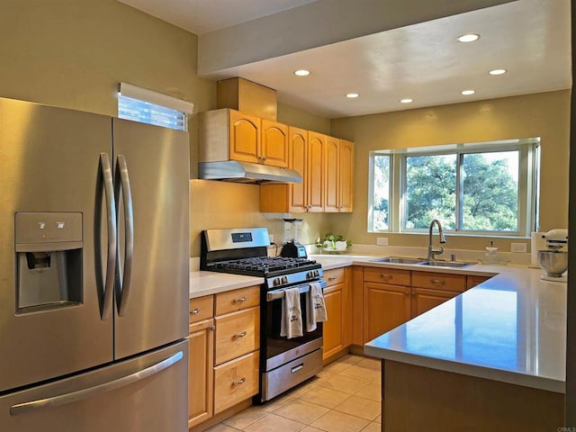 kitchen featuring light brown cabinetry, sink, appliances with stainless steel finishes, and light tile patterned flooring