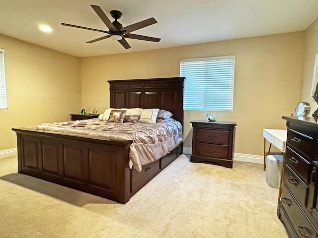 bedroom with light colored carpet and ceiling fan