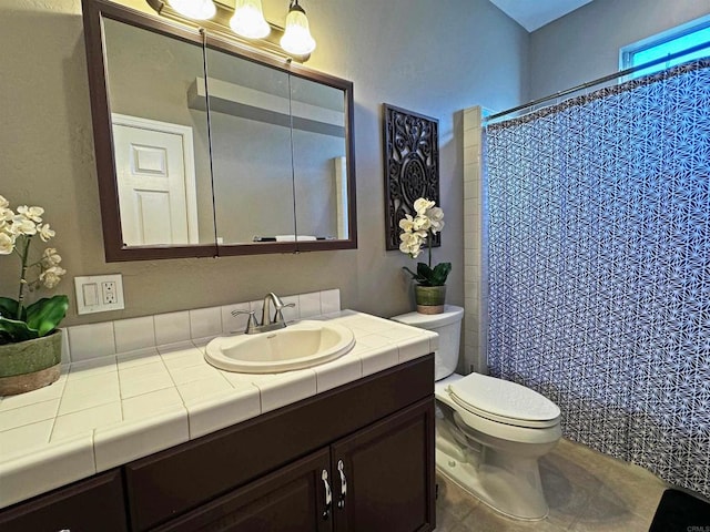 bathroom featuring vanity, toilet, tile patterned floors, and walk in shower