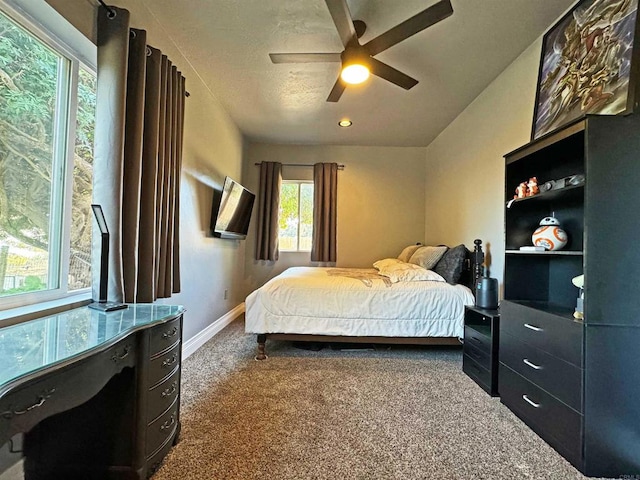 carpeted bedroom featuring ceiling fan