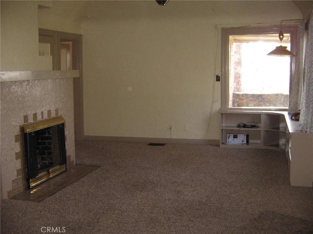 unfurnished living room with carpet flooring