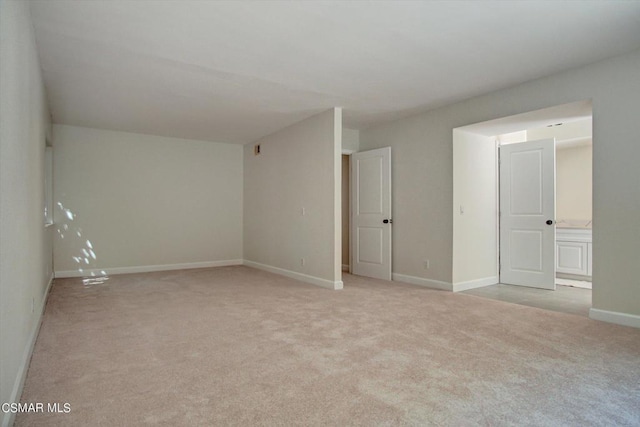 spare room with light colored carpet