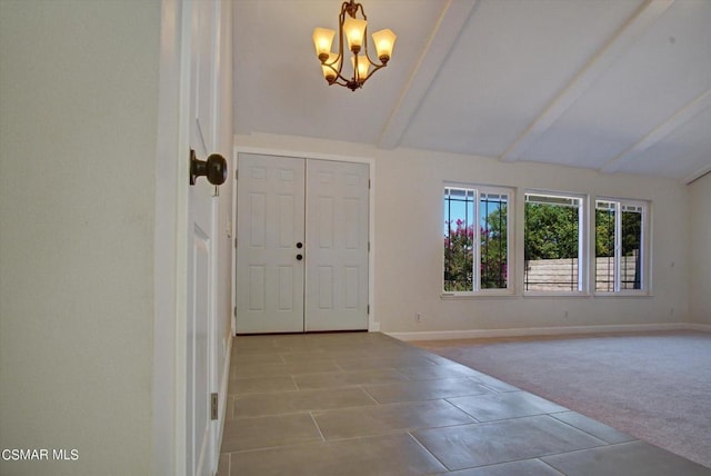 entryway featuring light colored carpet, an inviting chandelier, and vaulted ceiling with beams