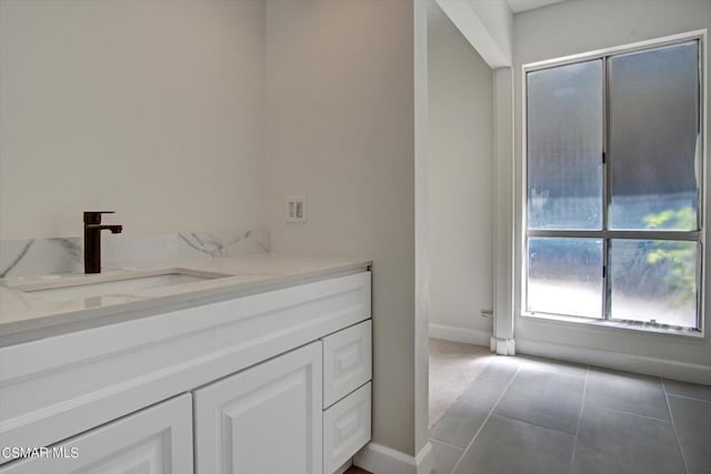 bathroom featuring tile patterned flooring and vanity