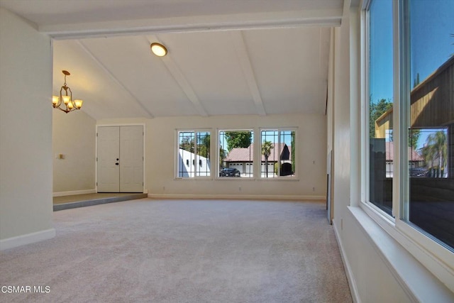 unfurnished living room featuring light carpet, a chandelier, and lofted ceiling with beams