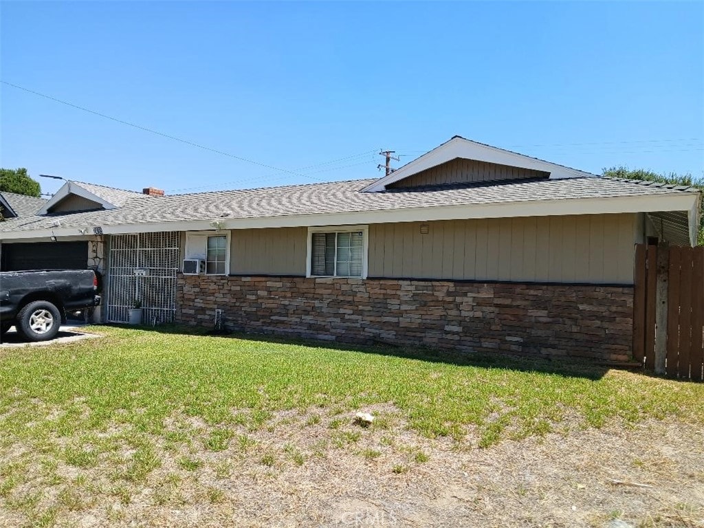 view of home's exterior with a lawn