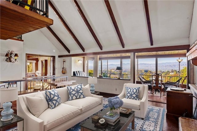 living room with a mountain view, beamed ceiling, high vaulted ceiling, and hardwood / wood-style flooring