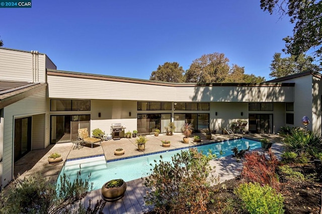 back of house with a patio area