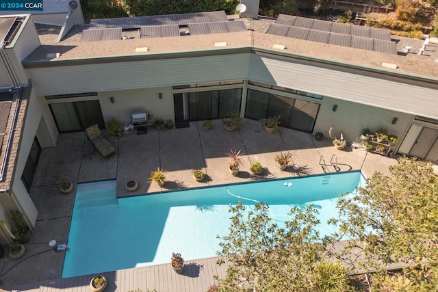 view of swimming pool featuring area for grilling