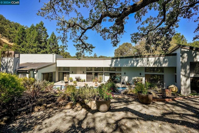 back of house featuring a patio area