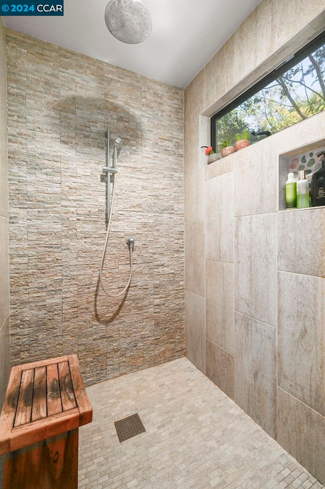 bathroom featuring tiled shower