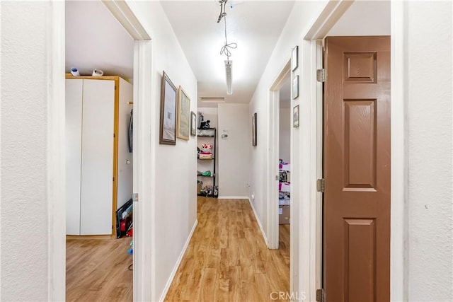 hallway featuring light hardwood / wood-style flooring