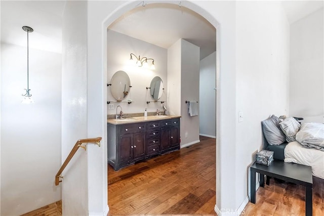 bathroom with hardwood / wood-style floors and vanity