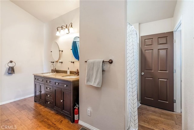 bathroom featuring vanity and hardwood / wood-style flooring