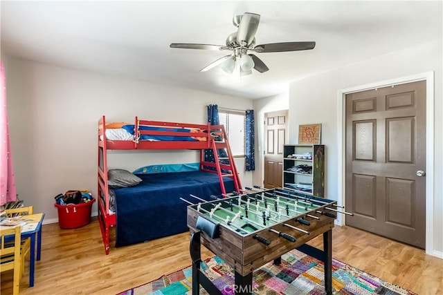 bedroom with ceiling fan and wood-type flooring