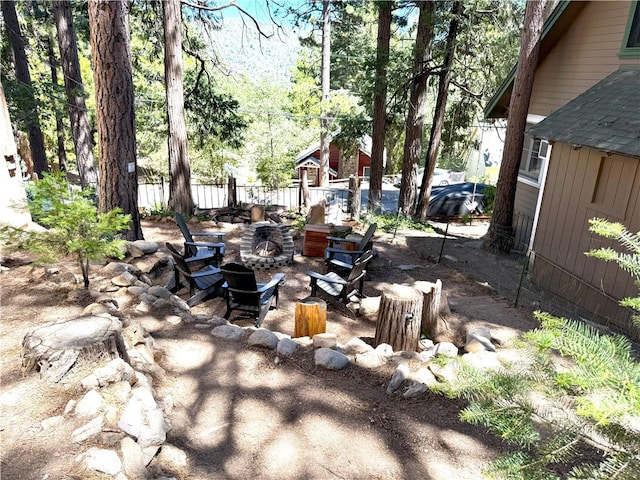 view of yard with a fire pit