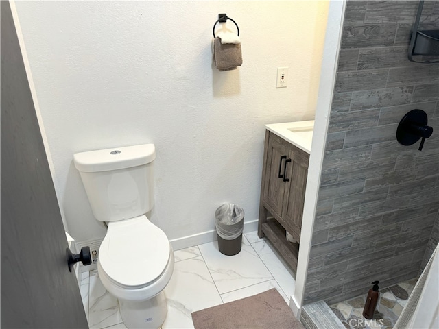 bathroom with toilet and vanity