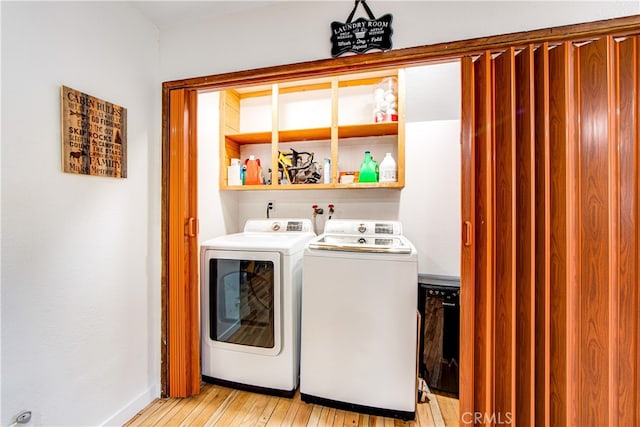 laundry room featuring light hardwood / wood-style flooring and independent washer and dryer