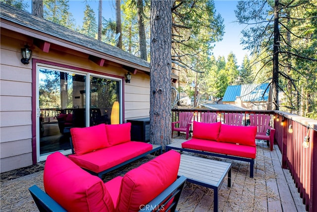 view of patio with outdoor lounge area and a wooden deck