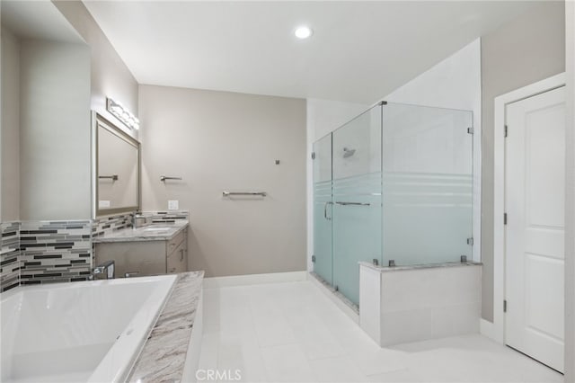 bathroom featuring vanity, shower with separate bathtub, and tile patterned flooring