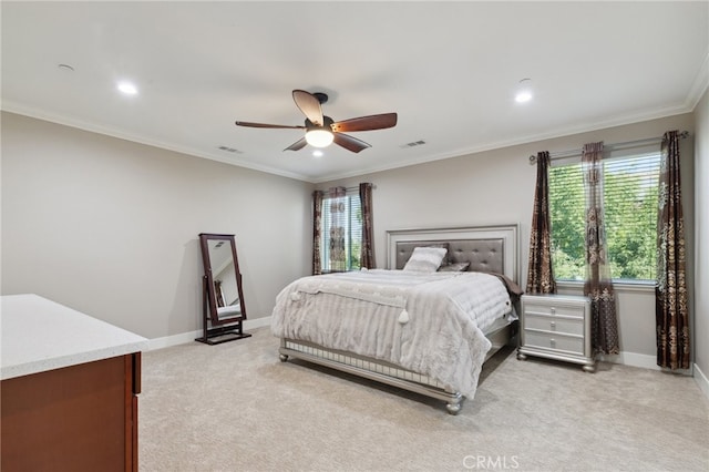 bedroom featuring ornamental molding, ceiling fan, and light colored carpet