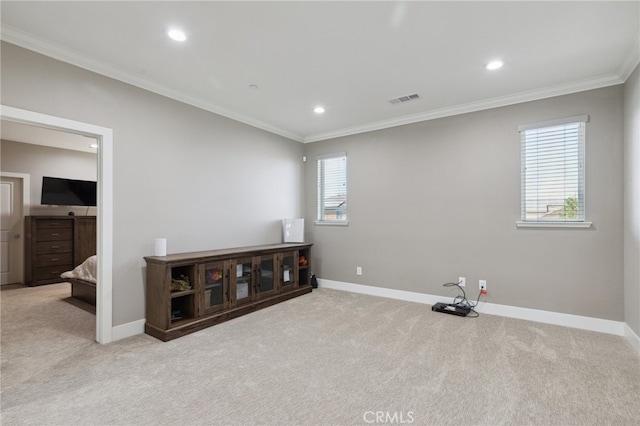 interior space with light carpet and crown molding