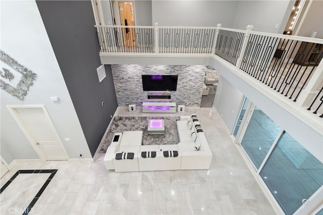 living room with a towering ceiling