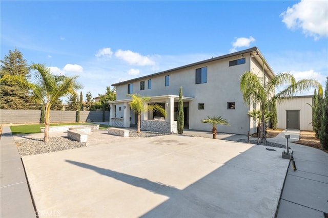 rear view of house featuring a patio area