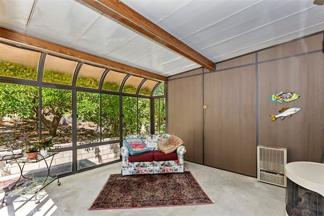 sunroom / solarium with beamed ceiling and heating unit