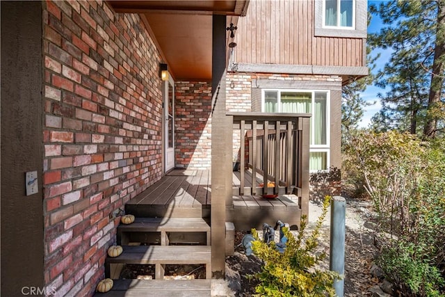 doorway to property with a wooden deck