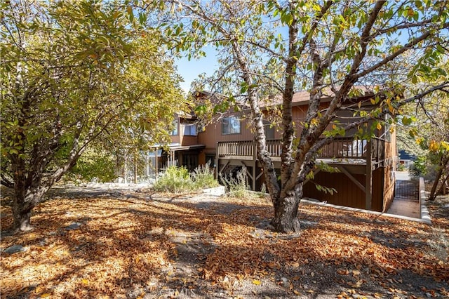 rear view of house with a wooden deck