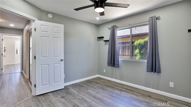 spare room featuring ceiling fan and wood-type flooring