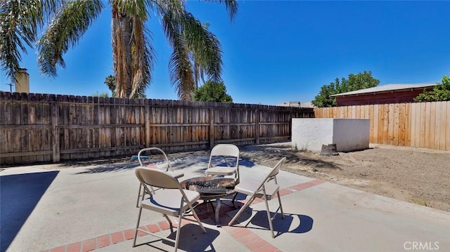 view of patio / terrace featuring a fire pit