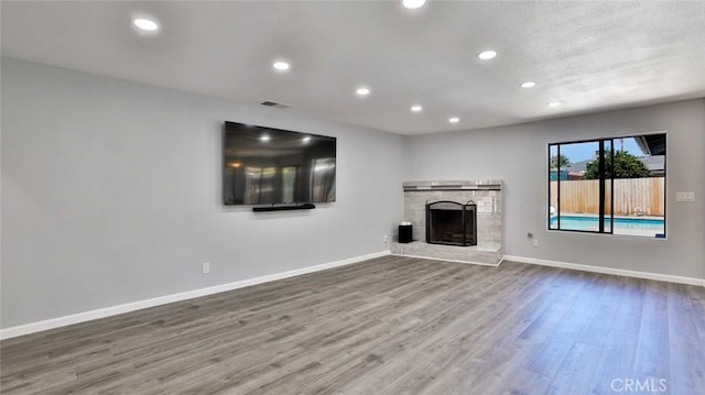 unfurnished living room with wood-type flooring