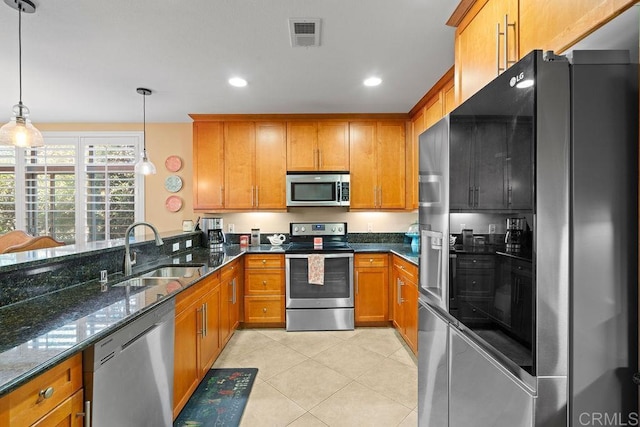 kitchen featuring a sink, brown cabinets, and appliances with stainless steel finishes