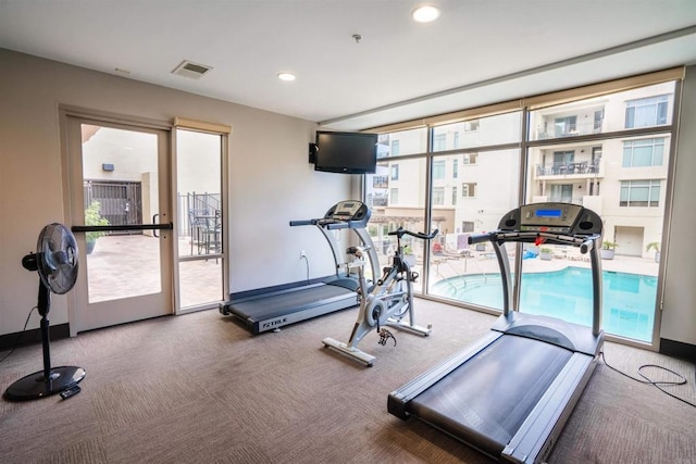 exercise room featuring carpet, recessed lighting, baseboards, and visible vents