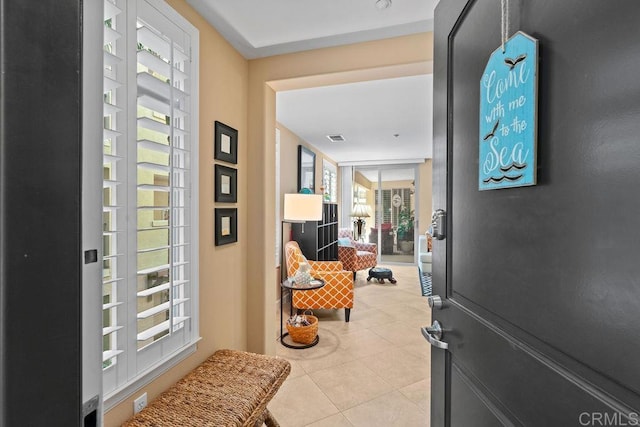 foyer with tile patterned floors