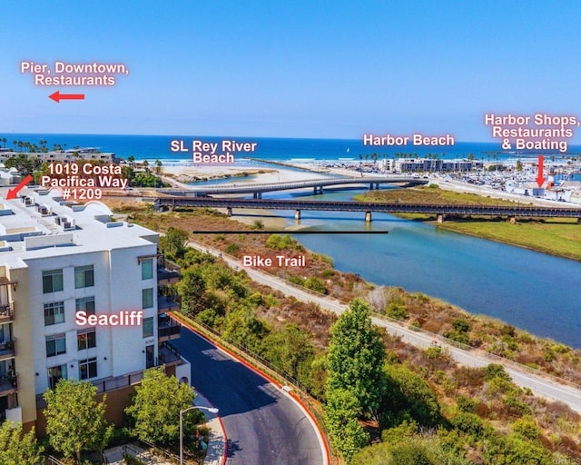 birds eye view of property with a water view