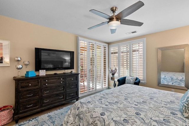 bedroom featuring visible vents and a ceiling fan