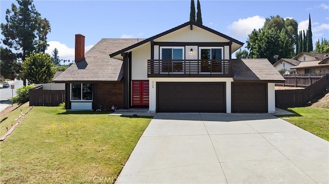 view of front of home featuring a front yard, a garage, and a balcony