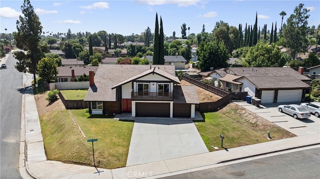 front of property with a front yard and a garage