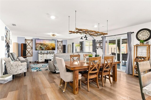 dining area with light hardwood / wood-style floors