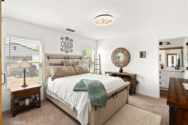 bedroom with light colored carpet