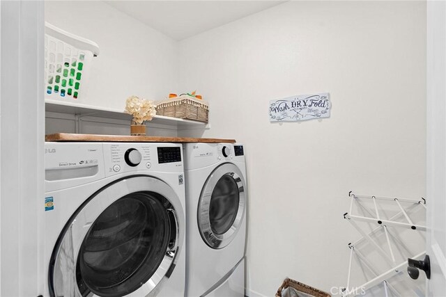 laundry room featuring washer and clothes dryer