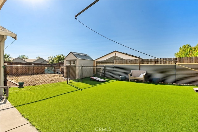 view of yard featuring a storage unit