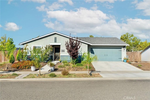 ranch-style house featuring driveway, fence, an attached garage, and stucco siding