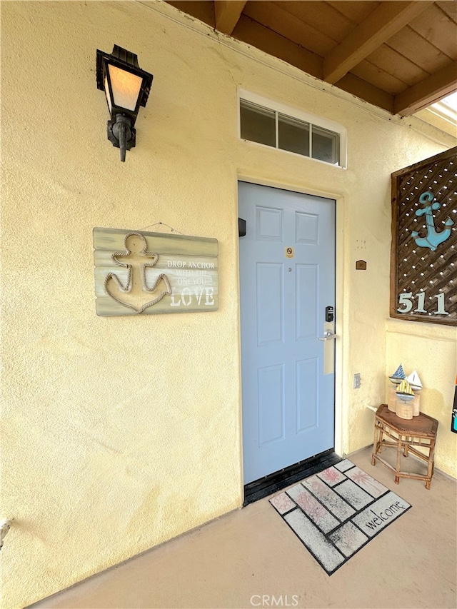 doorway to property featuring a patio