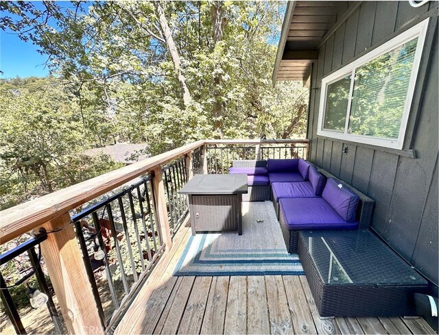 wooden deck with outdoor lounge area